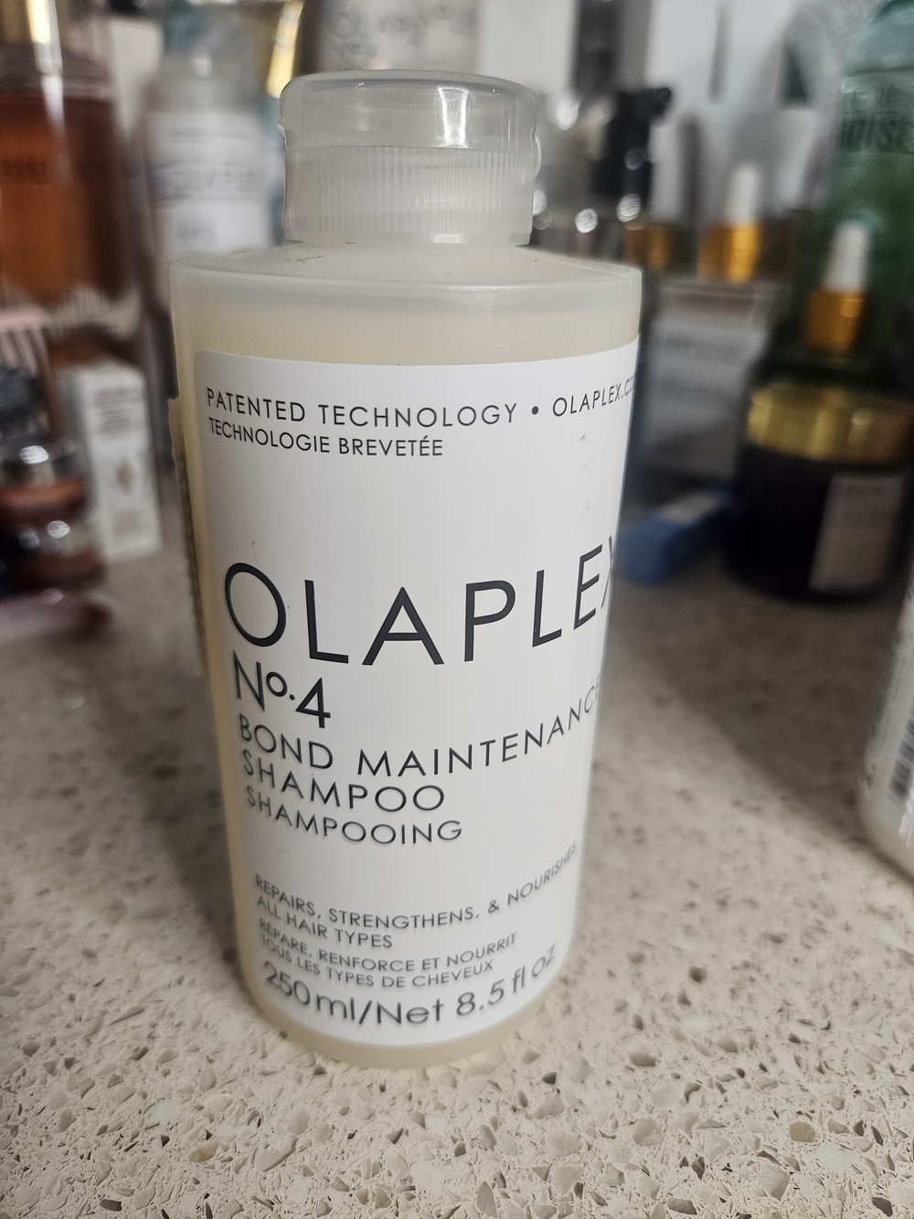OLAPLEX No.4 Bond Maintenance Shampoo - White Bottle with Black Text